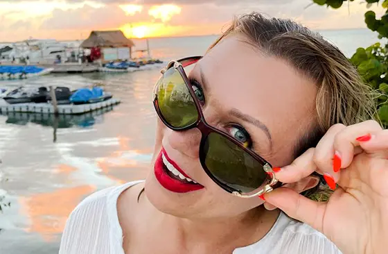 woman patient showing her cosmetic dental work in cancun