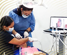 cancun dental design dentist during the preparation process of root canal therapy