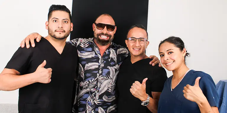 youn man with full mouth reconstruction smiling