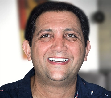 patient with a full set of emax dental crowns