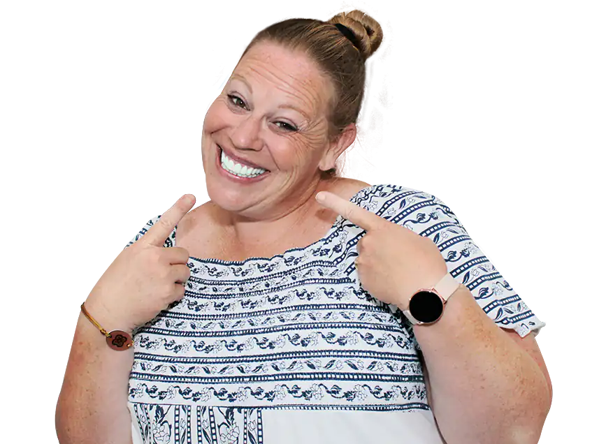 blonde woman smiling after having a root canal therapy in mexico