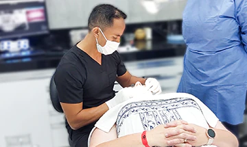 cancun dental design endodontist performing a root canal therapy