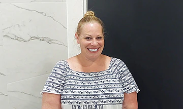 female patient at cancun dental design smiling after her root canal treatment and cosmetic restoration