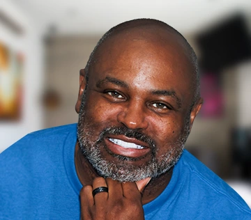 patient with a full set of porcelain and zirconia crowns